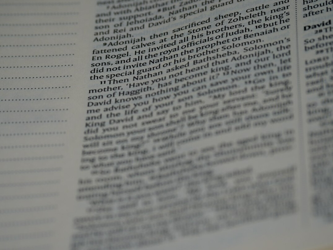 Open printed investigative report with highlighted paragraphs